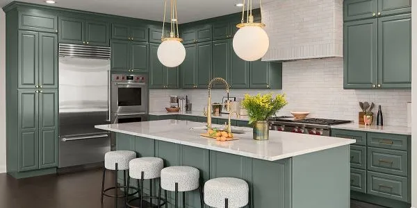 Modern kitchen design with green cabinets and white island